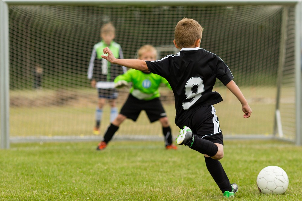 7 Important Skills to Teach Kids the Basics of Football